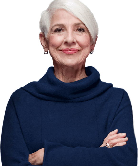 A woman in a blue sweater with her arms crossed